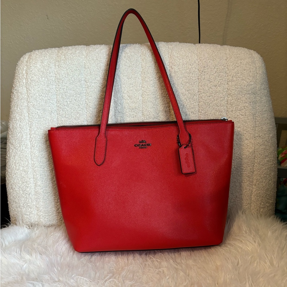 Coach red tote with black metal decal
